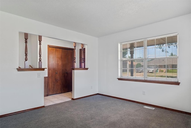 unfurnished room featuring light colored carpet