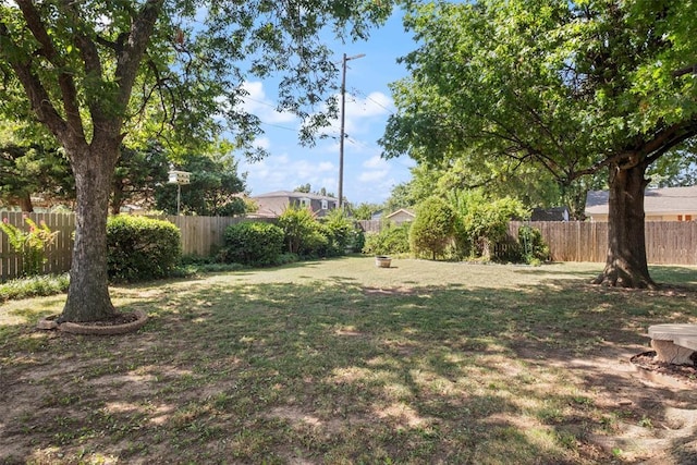 view of yard featuring a fire pit