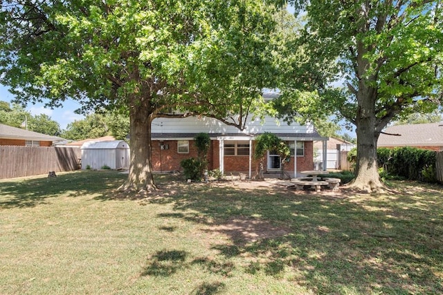 exterior space with a yard and a storage shed