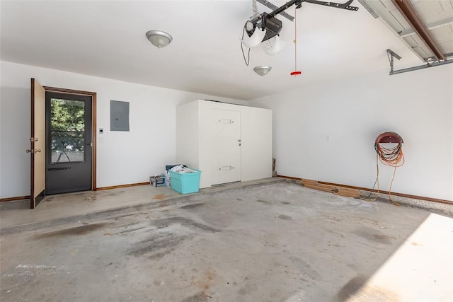 garage with electric panel and a garage door opener