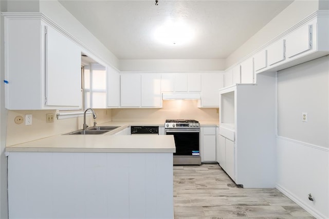 kitchen with white cabinetry, sink, kitchen peninsula, light wood-type flooring, and stainless steel range with gas cooktop
