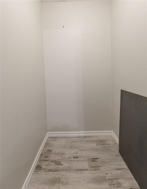 unfurnished room with light hardwood / wood-style floors