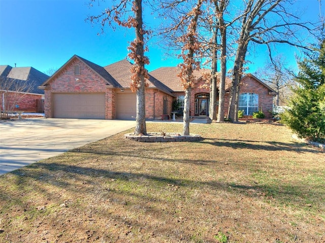 ranch-style home featuring a garage and a front lawn