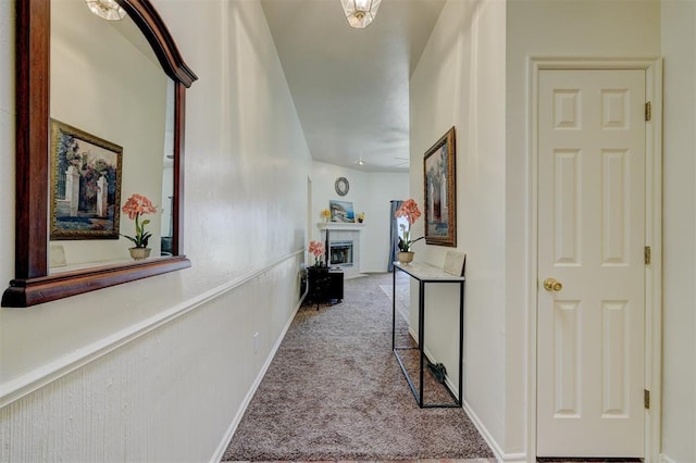 hall with light colored carpet