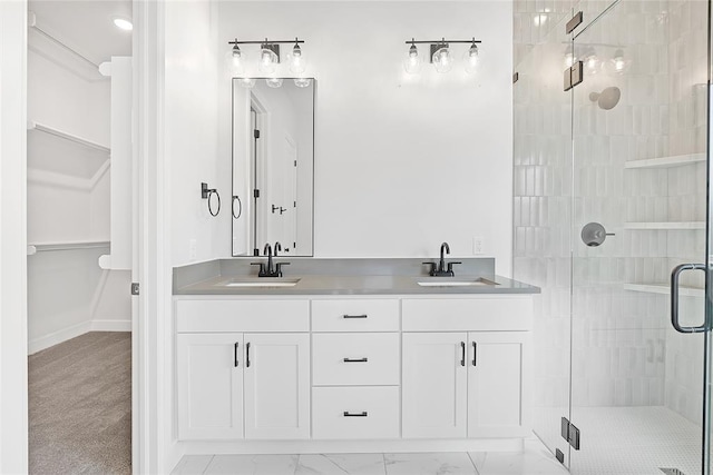 bathroom featuring vanity and an enclosed shower