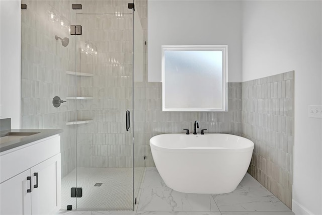 bathroom with vanity, tile walls, and plus walk in shower