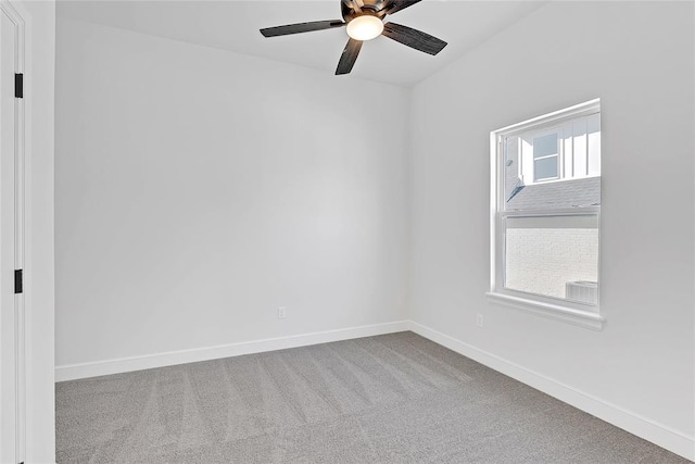 unfurnished room featuring light carpet and ceiling fan