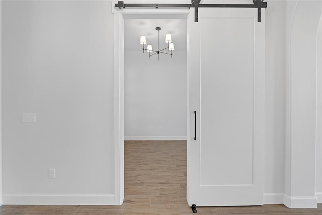interior space with hardwood / wood-style flooring and an inviting chandelier