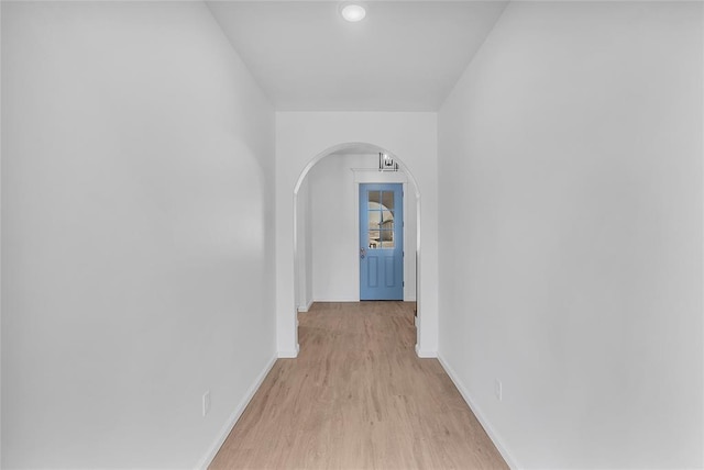 hall with light hardwood / wood-style floors