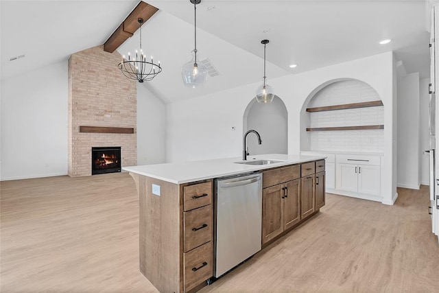 kitchen with white cabinetry, dishwasher, sink, and hanging light fixtures