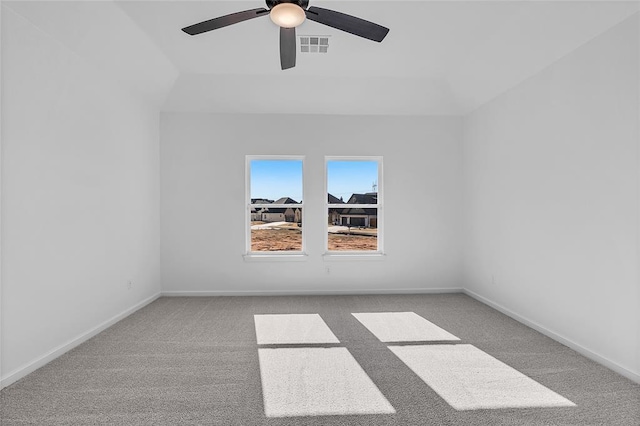 carpeted spare room with ceiling fan