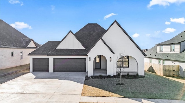 view of front of property with a garage and a front lawn