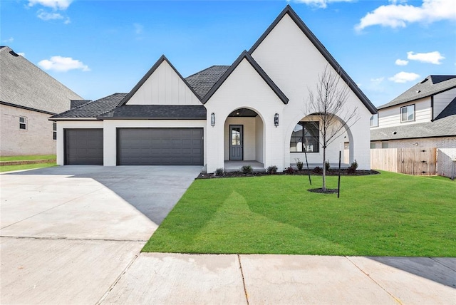 view of front of home featuring a garage and a front yard