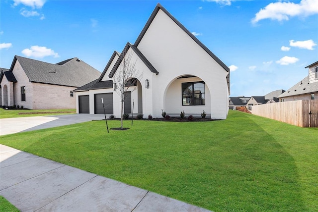 view of front of house featuring a garage and a front yard