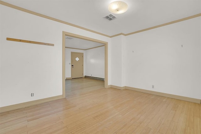 empty room with light hardwood / wood-style flooring, a baseboard heating unit, and ornamental molding