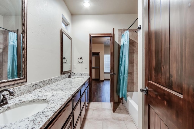 bathroom featuring vanity, tile patterned flooring, and shower / bath combo with shower curtain