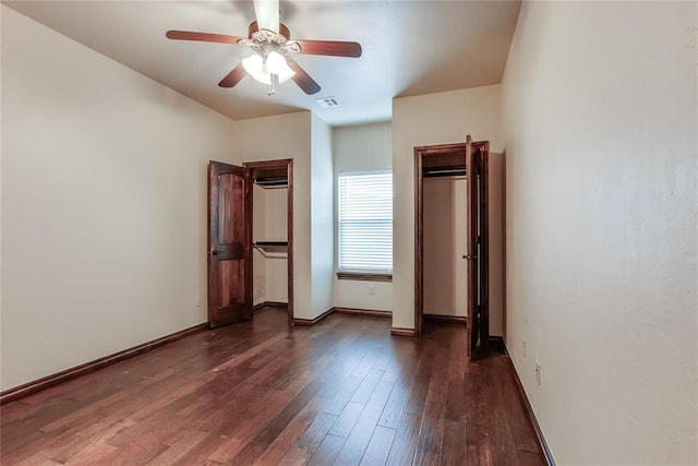 unfurnished bedroom featuring ceiling fan and dark hardwood / wood-style flooring