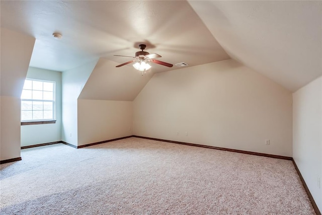 bonus room featuring ceiling fan, light colored carpet, and vaulted ceiling