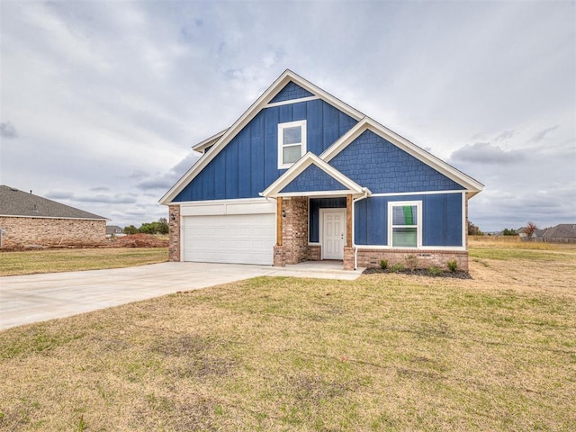 craftsman-style home featuring an attached garage, brick siding, concrete driveway, board and batten siding, and a front yard