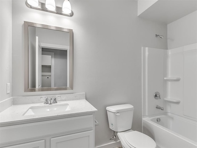 bathroom with bathtub / shower combination, vanity, and toilet