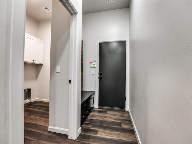 corridor featuring dark hardwood / wood-style flooring