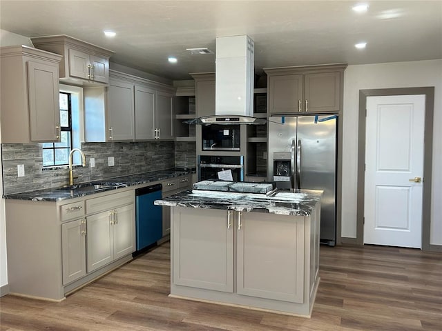 kitchen with gray cabinets, island exhaust hood, and stainless steel appliances