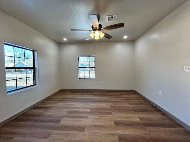 spare room featuring ceiling fan and wood-type flooring