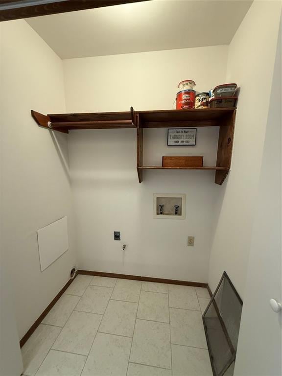 clothes washing area with washer hookup, hookup for a gas dryer, hookup for an electric dryer, laundry area, and baseboards