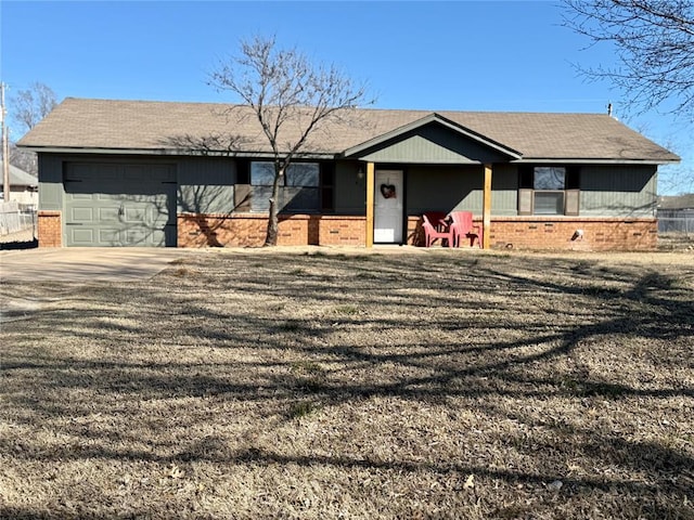 ranch-style home featuring concrete driveway, brick siding, and an attached garage