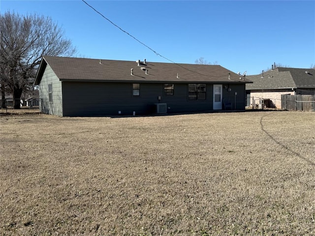 back of house featuring fence and central AC unit