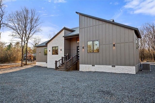 view of front of property featuring central air condition unit