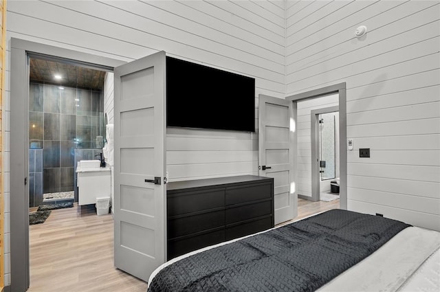 bedroom with light hardwood / wood-style floors