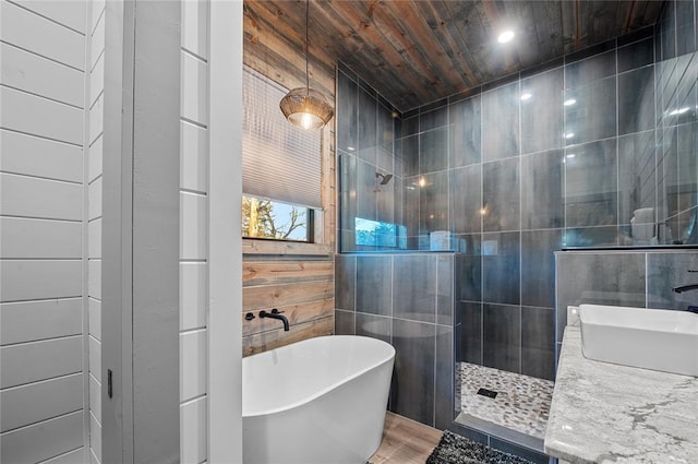 bathroom with wood walls, wood ceiling, and shower with separate bathtub