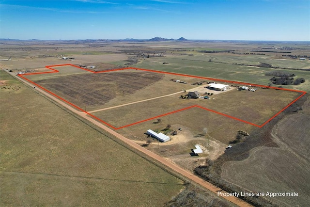 birds eye view of property with a rural view