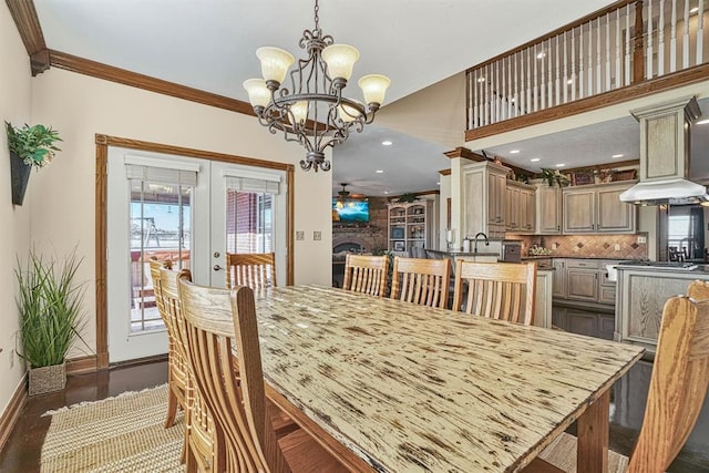 dining area featuring french doors, ornamental molding, ceiling fan with notable chandelier, and a wealth of natural light