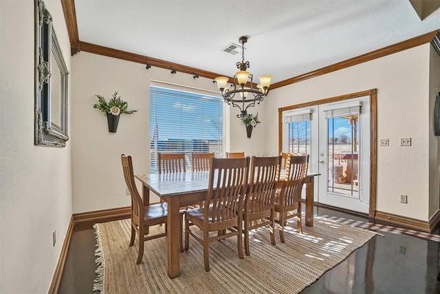 dining space with crown molding, a chandelier, and french doors