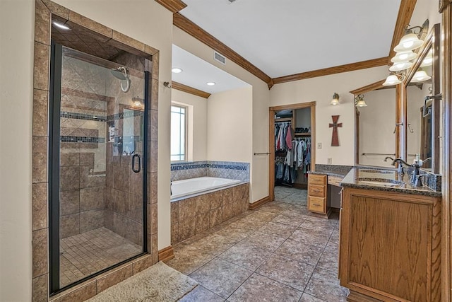 bathroom featuring crown molding, vanity, shower with separate bathtub, and tile patterned flooring