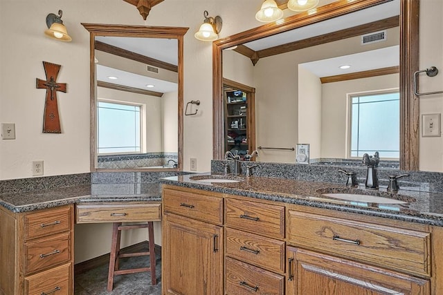 bathroom with vanity and ornamental molding