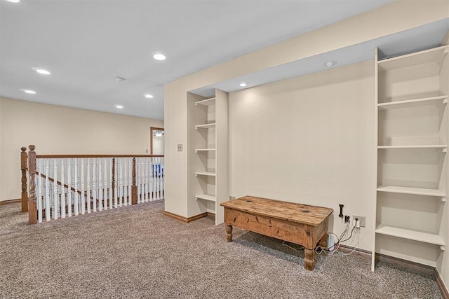 interior space featuring carpet and built in features