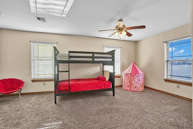 bedroom with ceiling fan and carpet