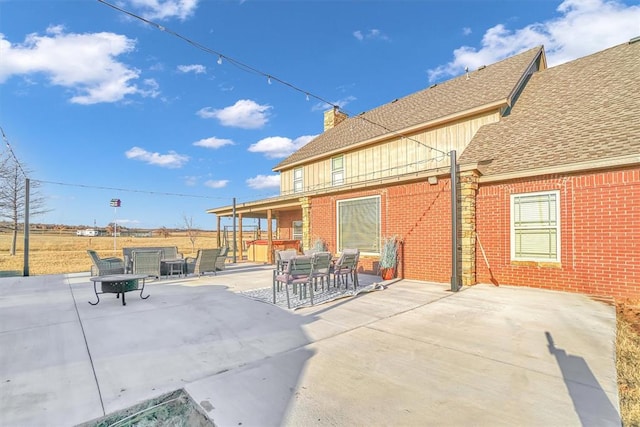 view of patio featuring a hot tub