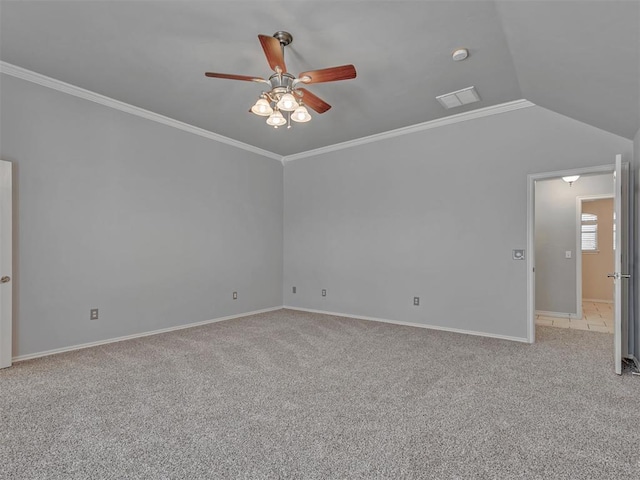 spare room featuring ceiling fan, lofted ceiling, and light colored carpet