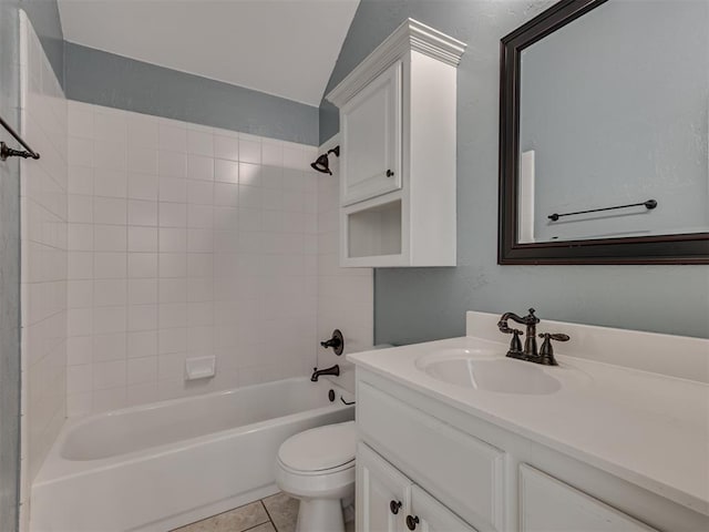 full bathroom featuring shower / tub combination, lofted ceiling, tile patterned flooring, vanity, and toilet