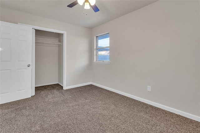 unfurnished bedroom featuring ceiling fan, a closet, and carpet floors