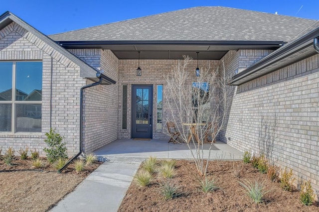 property entrance featuring a patio area