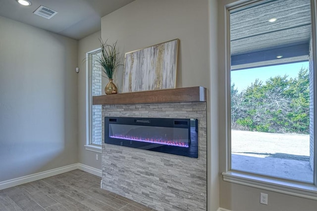 interior details with a stone fireplace