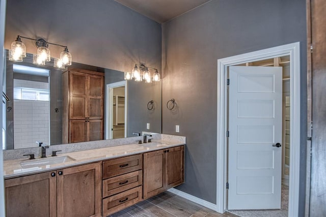 bathroom with a shower and vanity