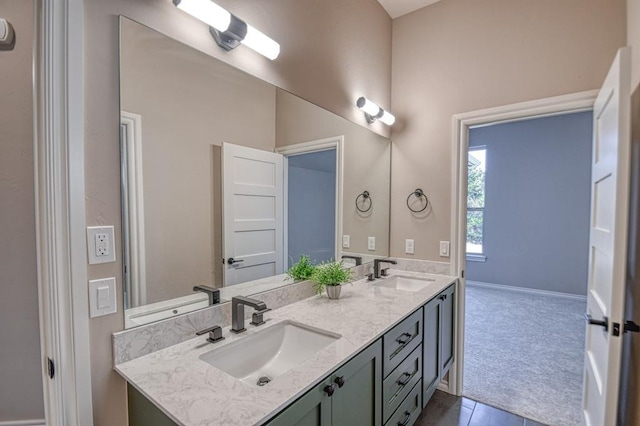 bathroom with vanity and tile patterned flooring