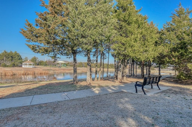 view of community with a water view and a gazebo