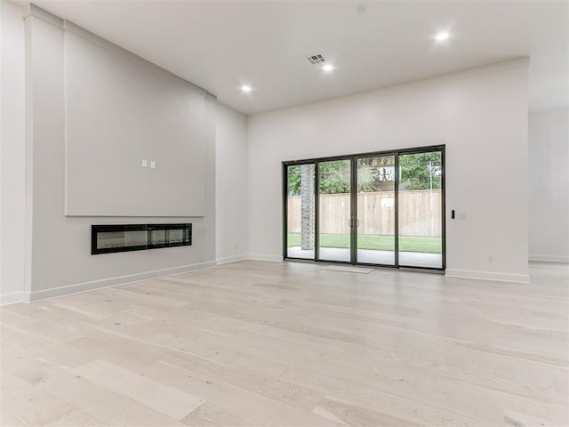 unfurnished living room featuring light wood-type flooring